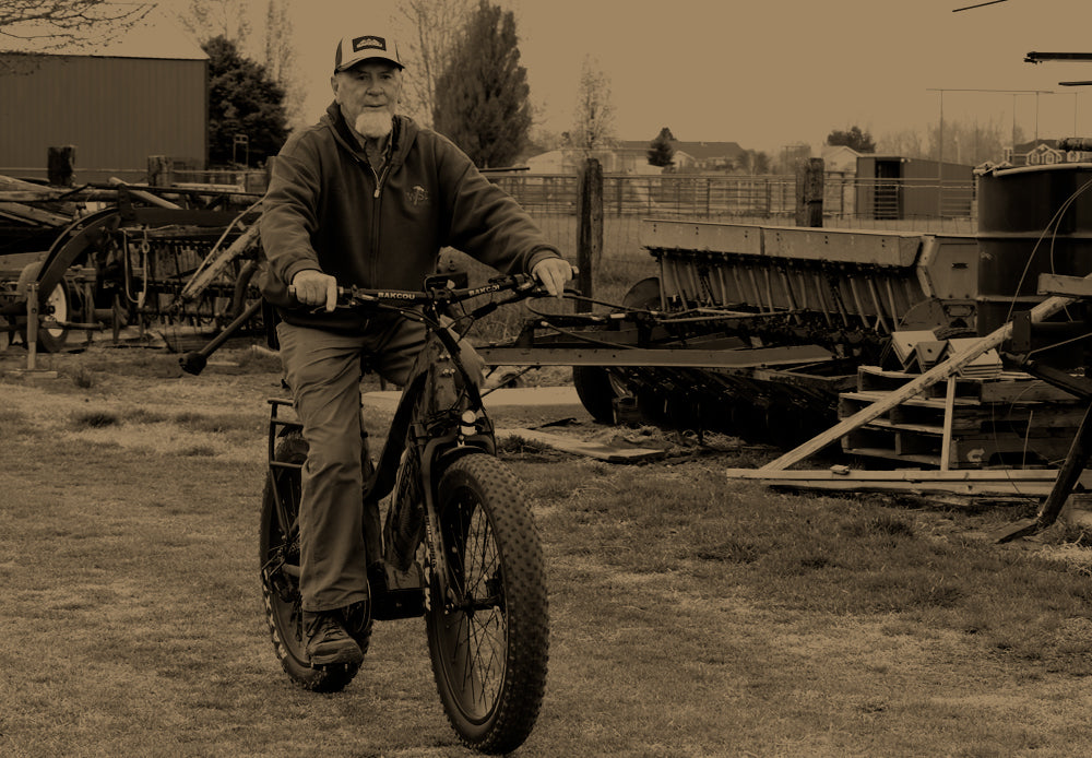 Rancher riding a Bakcou eBike on the farm