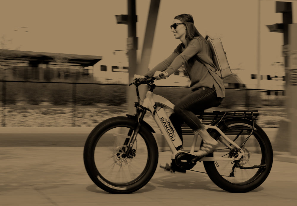 Woman biking to work on an Bakcou Mule ebike