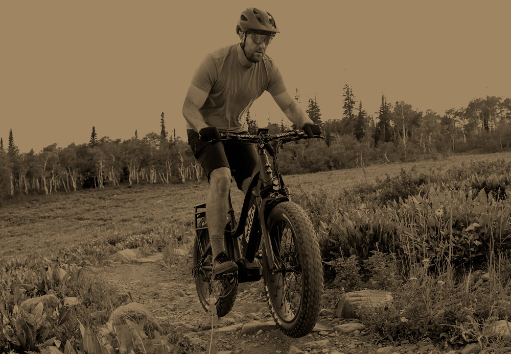 A man riding his eBike easily on a trail