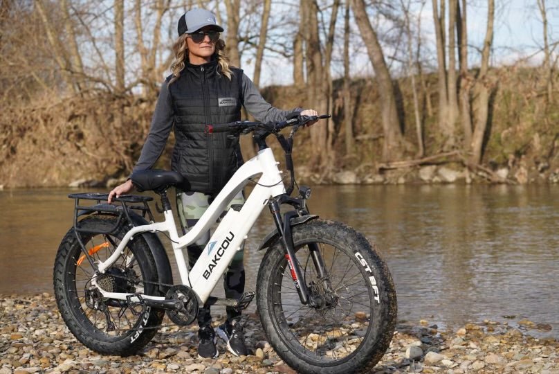 woman standing next to white Bakcou ebike